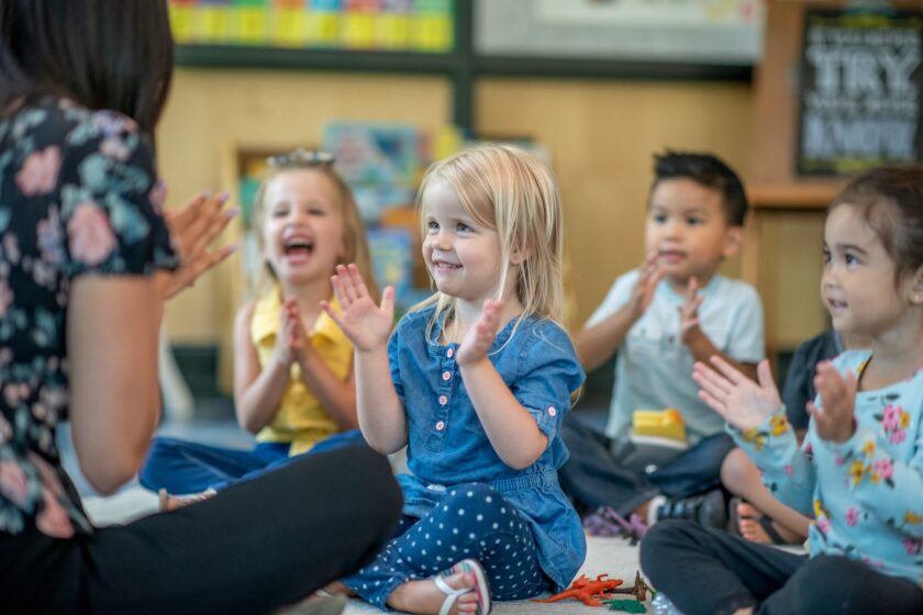 Kids engaging with their teacher.